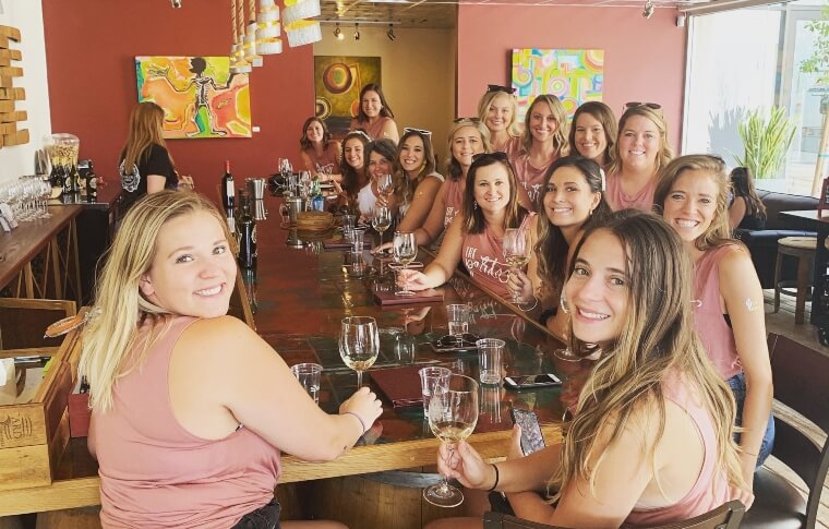 A group of females enjoying their wines during a bachelorette party